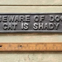 Beware of the dog the cat is shady too plaque